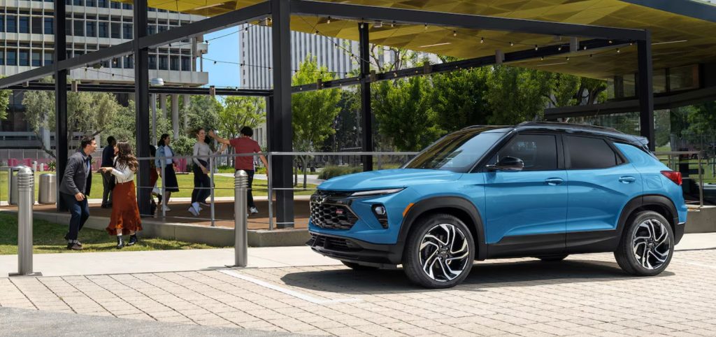 A new blue Chevy Trailblazer sits parked near a group of people and a greenspace, making this SUV the perfect city commuter and beyond. Shop for your new Trailblazer at Morristown Chevrolet near Knoxville.