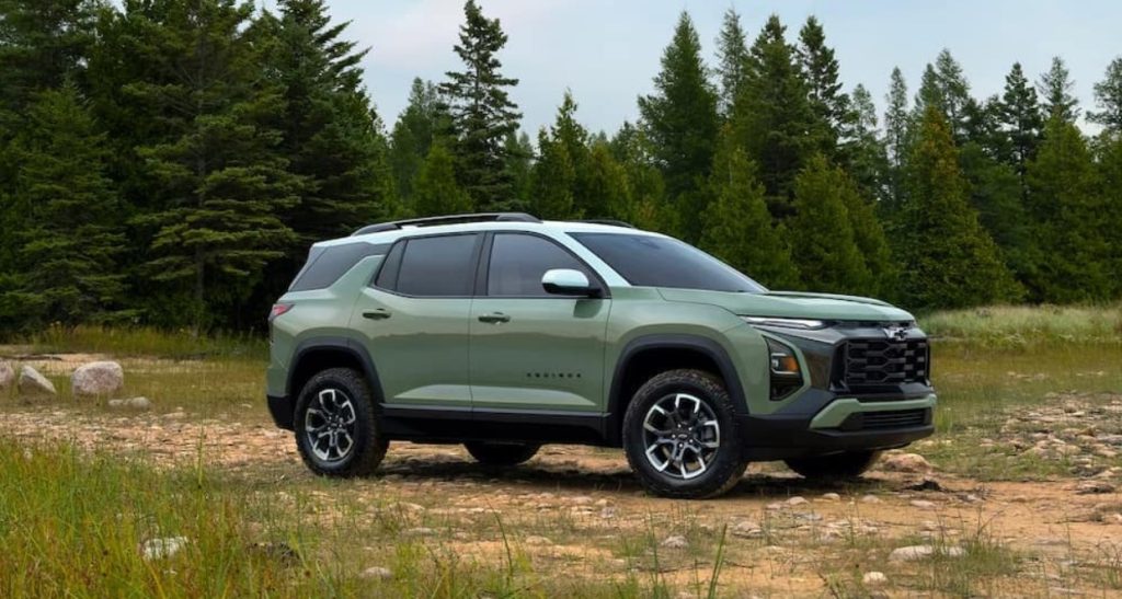 A new green Chevy Traverse sits on a dirt path surrounded by pine trees, making the Traverse the perfect adventure-ready SUV. Shop for yours at Morristown Chevrolet near Knoxville.