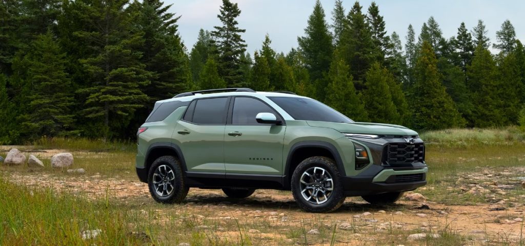 The green new Chevy Equinox sits parked on a dirt road with a forest in the background, making this SUV a perfect travel companion. Shop for your new Chevy Equinox at Morristown Chevrolet.