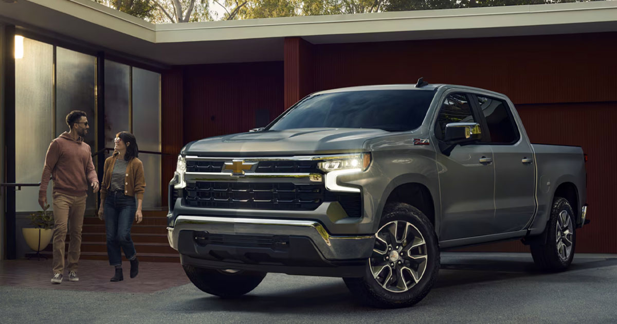 A Chevrolet Silverado 1500 parked in front of a home on the driveway