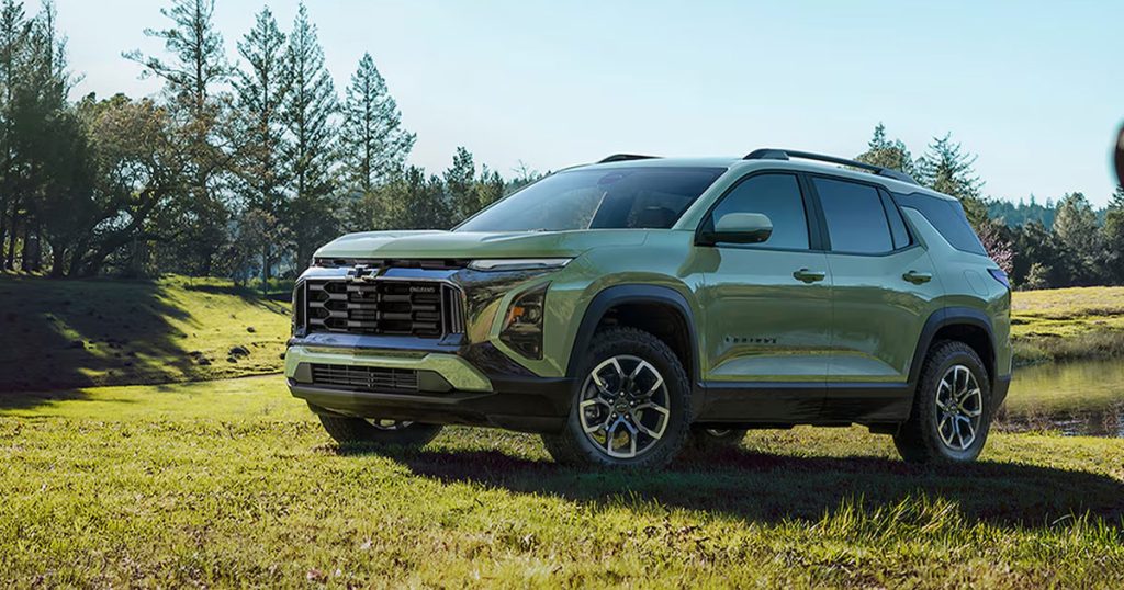 The 2026 Chevy Equinox sits parked near a lake.